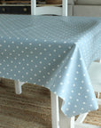 blue dotty tablecloth on a wooden table