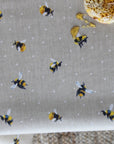 Oilcloth with bee pattern on a beige background
