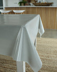Striped grey and white tablecloth on a table in a kitchen setting