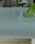 blue dotty oilcloth with a plant