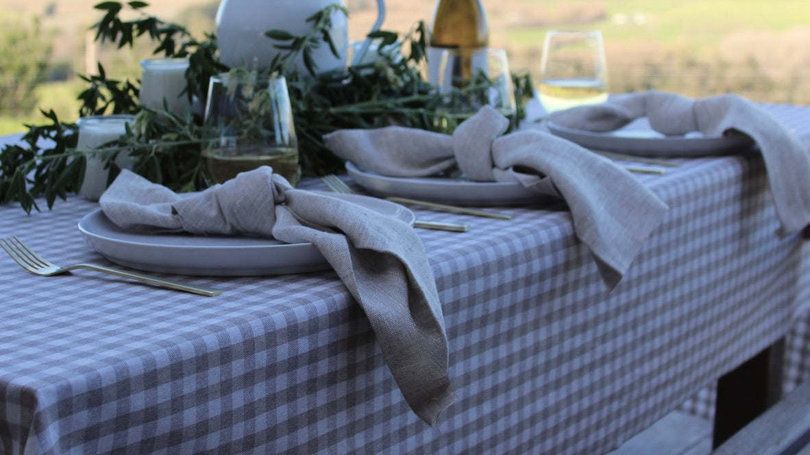Dining table set with floral centerpiece on a patio