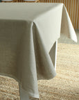 Beige tablecloth on a table in a room with wooden flooring
