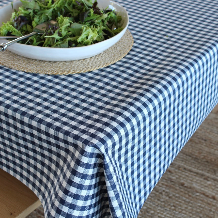 gingham check tablecloth with salad bowl on table