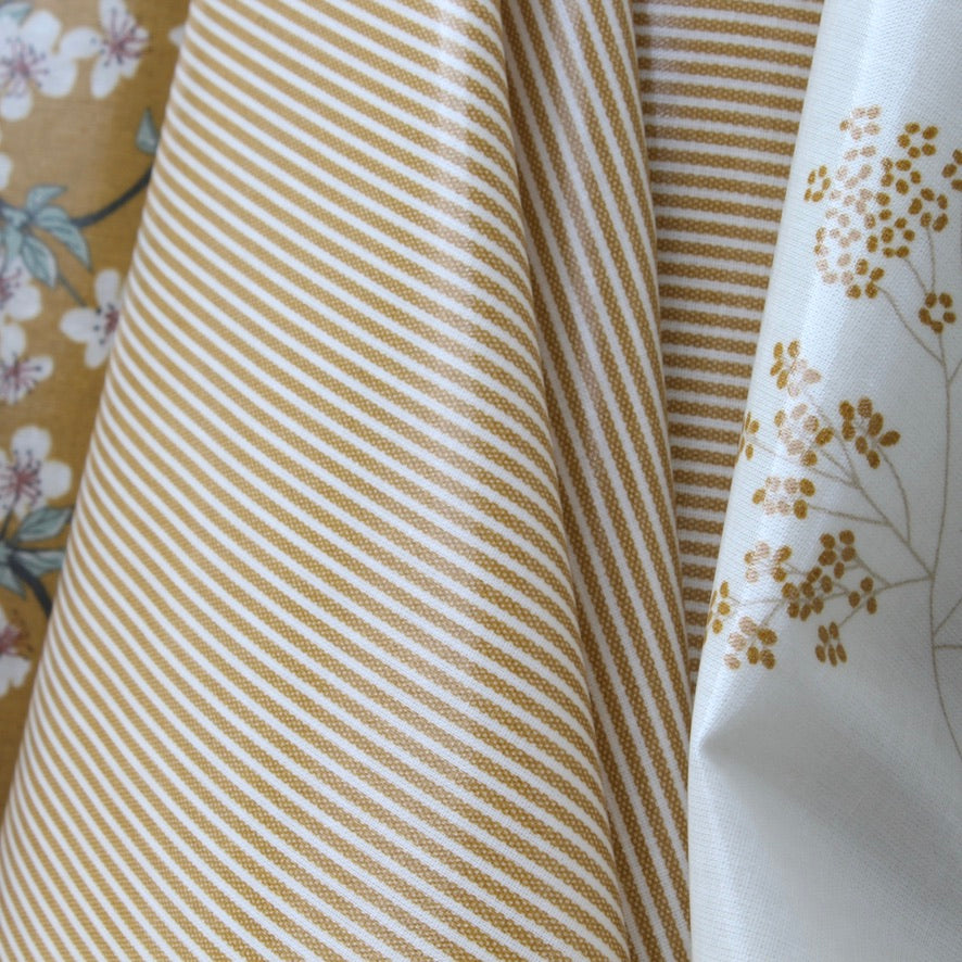 Close-up of striped oilcloth and floral-patterned oilcloth