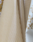 Close-up of striped oilcloth and floral-patterned oilcloth