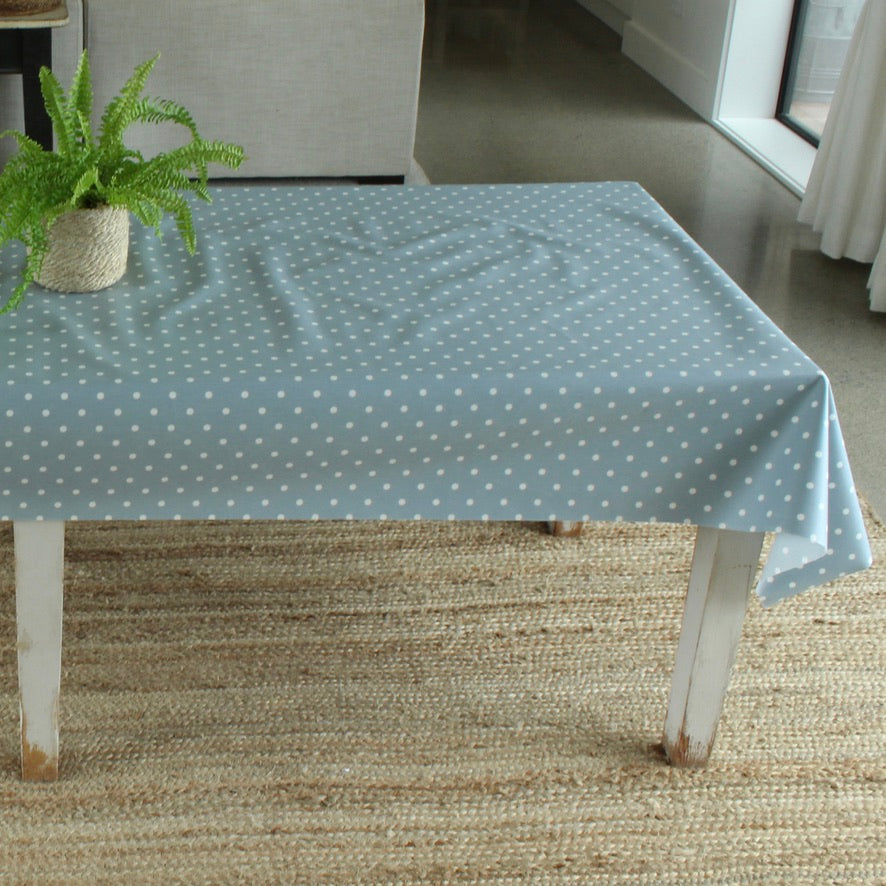 blue dotty oilcloth on a wooden table