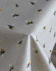 Oilcloth with bee pattern on a beige background