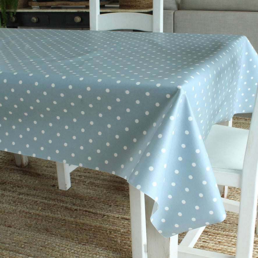 blue dotty tablecloth on a wooden table