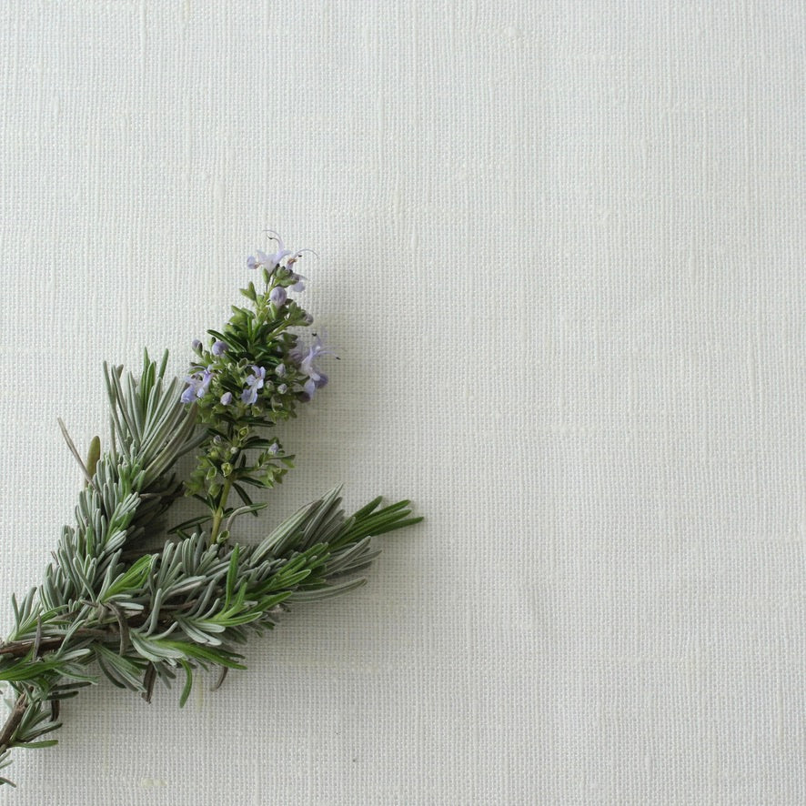 Bouquet of lavender on a white linen tablecloth background