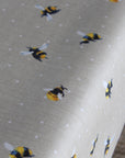 Oilcloth with bee pattern on a beige background