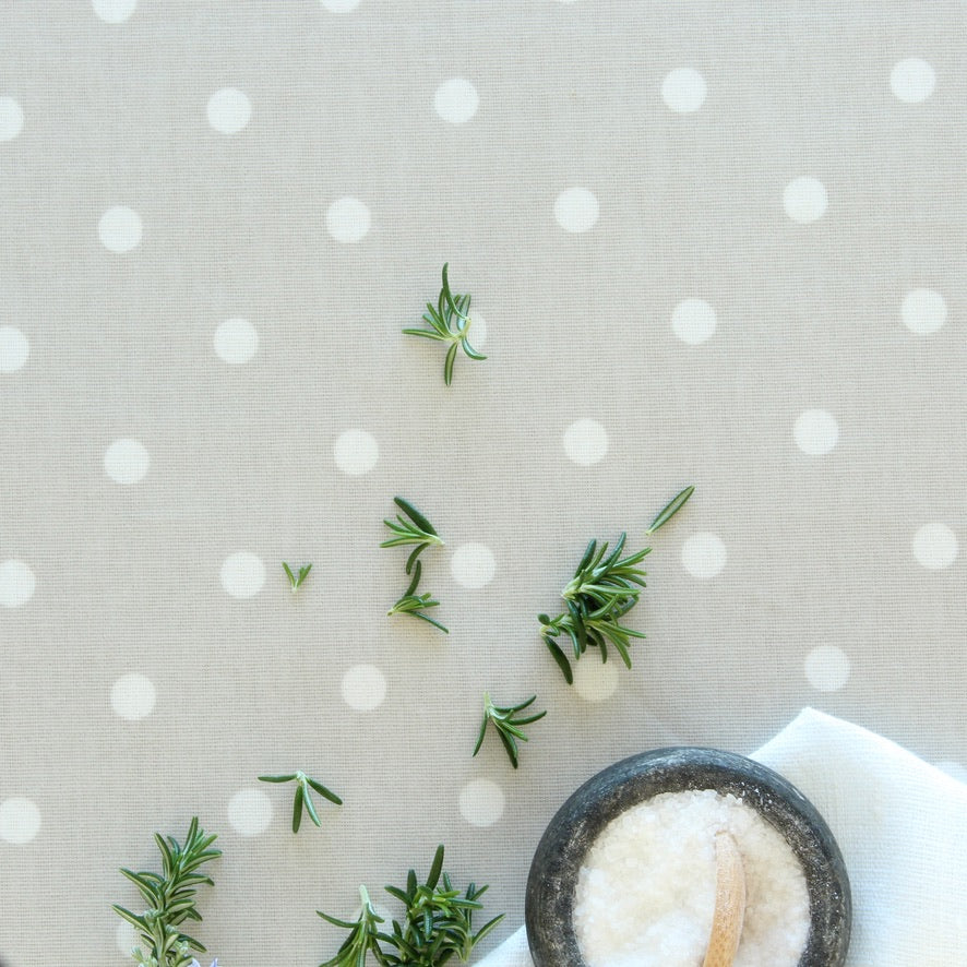 Rosemary leaves on a polka dot oilcloth background