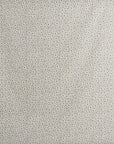Beige fabric with a small-scale pattern of white flowers