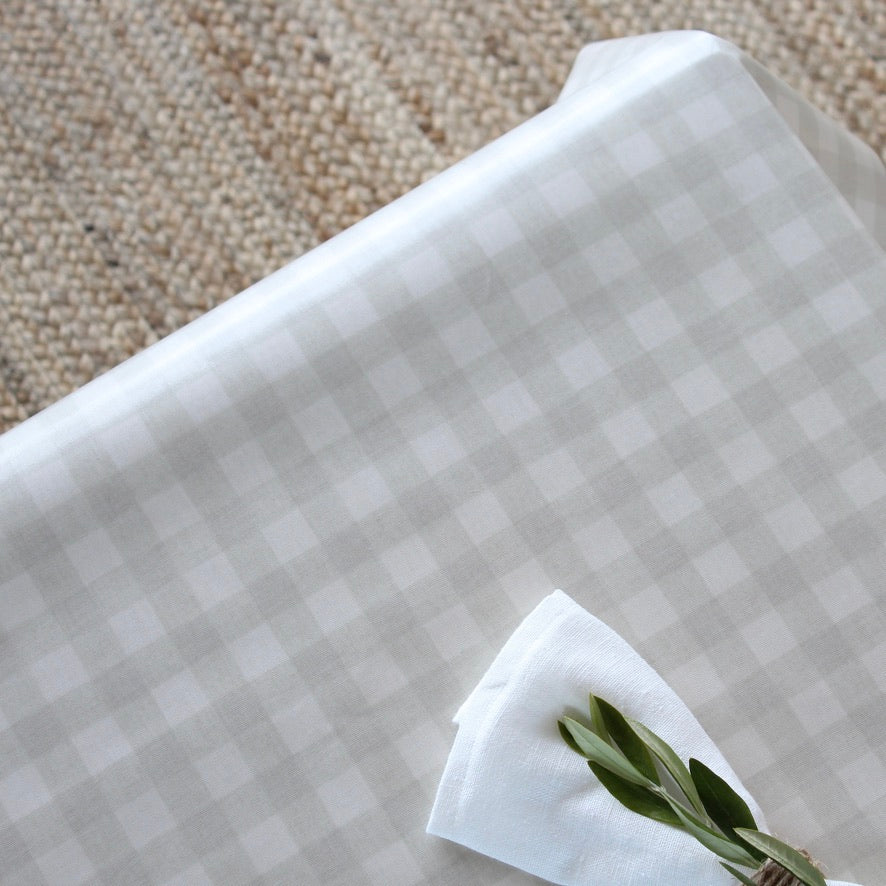 Checkered gingham oilcloth with white linen napkin
