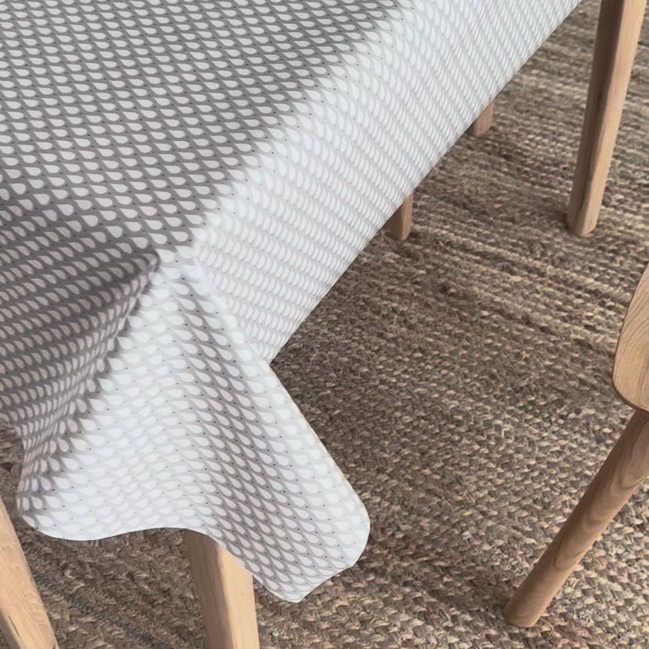 video of an oilcloth with teardrops design on a table