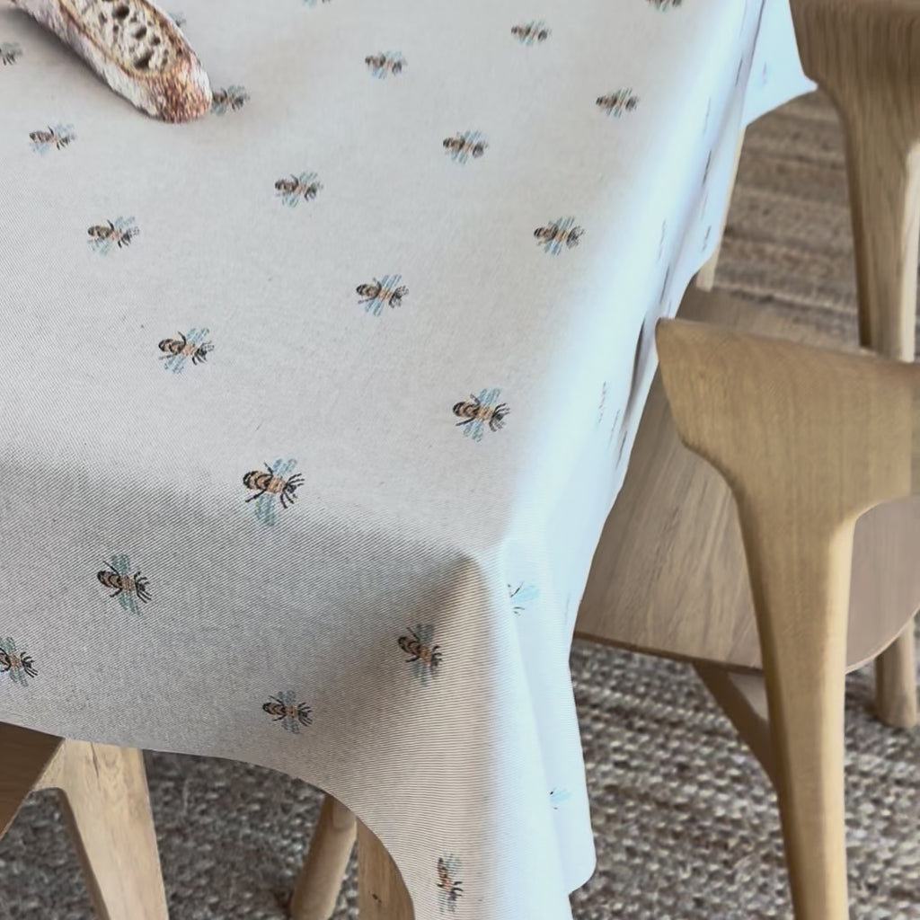 oilcloth with bees pattern on a wooden table