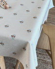 oilcloth with bees pattern on a wooden table